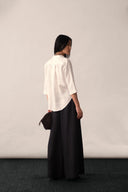 An ivory linen shirt featuring a mandarin collar and high-low hemline – PAYAL KHANDWALA